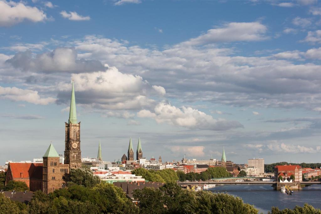 a view of a city with a clock tower at Steigenberger Hotel Bremen in Bremen