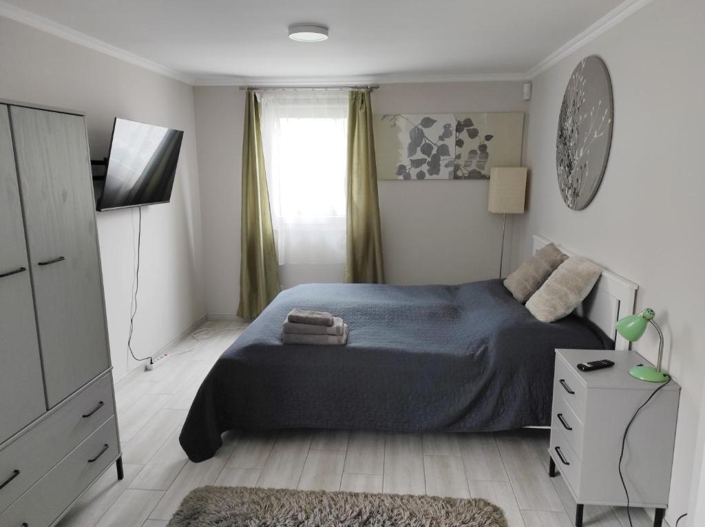 Postel nebo postele na pokoji v ubytování Garden Home