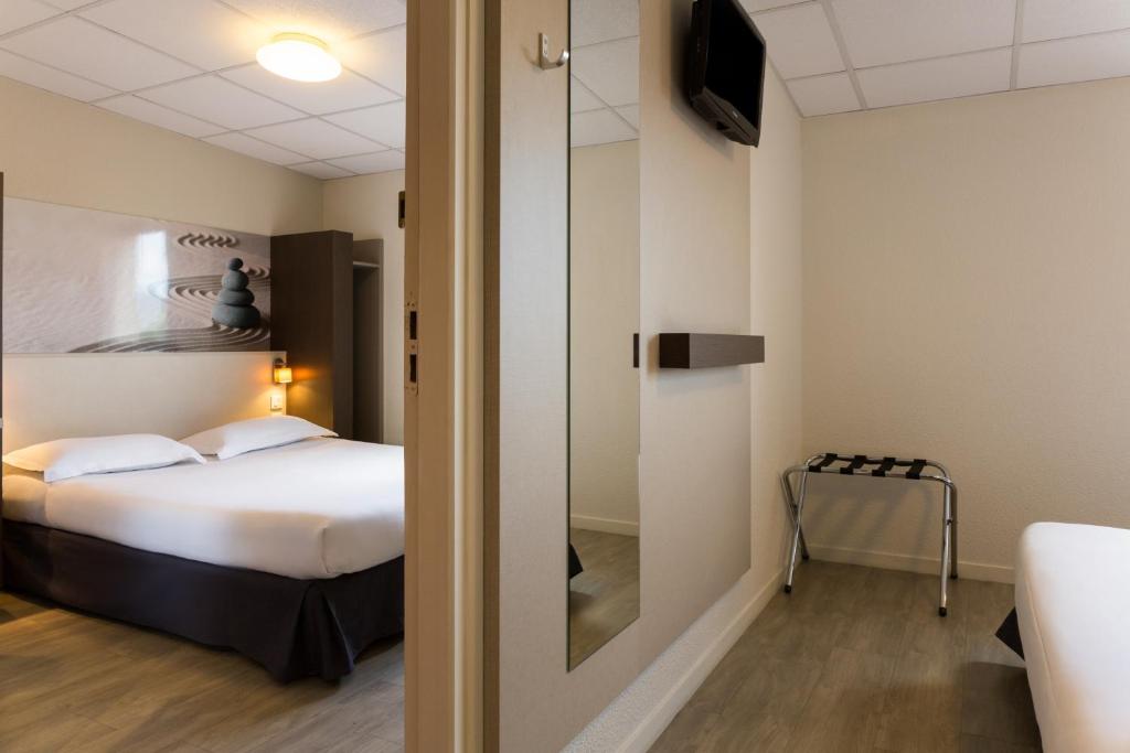 Postel nebo postele na pokoji v ubytování The Originals City, Hôtel Clermont-Ferrand Sud Aubière