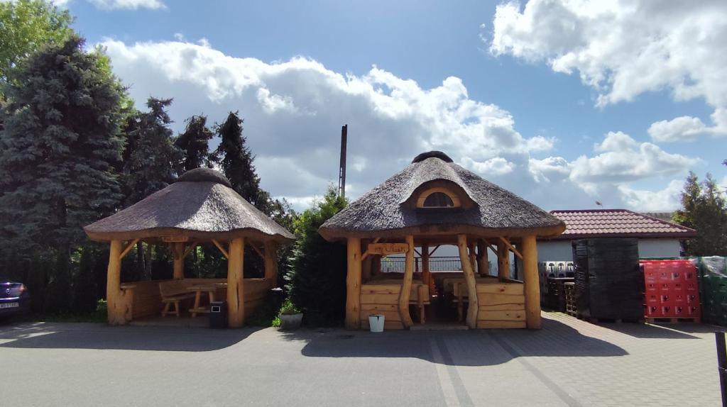 two gazebos in a parking lot at Henrix in Warsaw