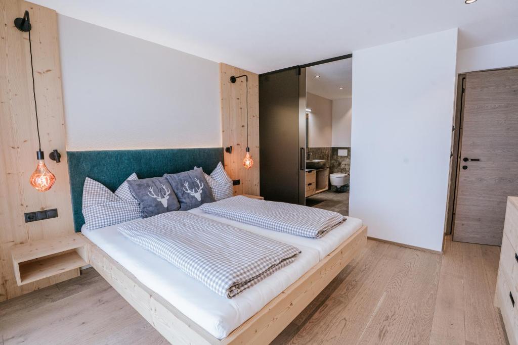Postel nebo postele na pokoji v ubytování Chalets Hansleitner