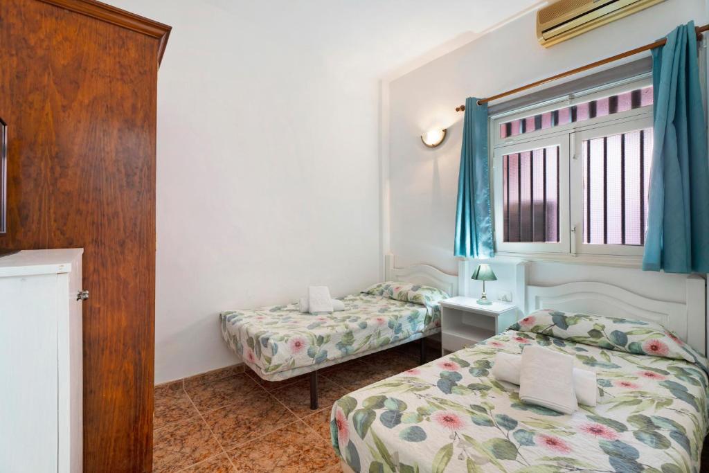 Łóżko lub łóżka w pokoju w obiekcie Casa Rural Paula By Paramount Holidays