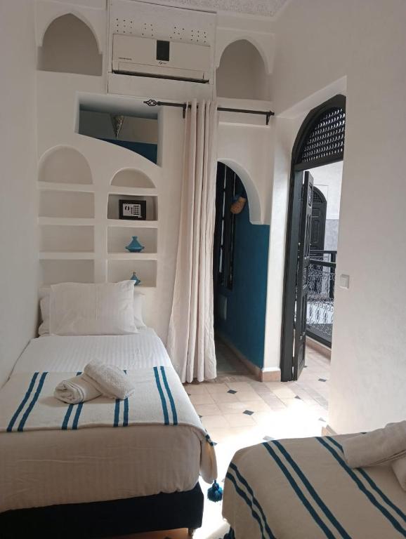 Postel nebo postele na pokoji v ubytování Le riad de l'étoile ocre - COTG