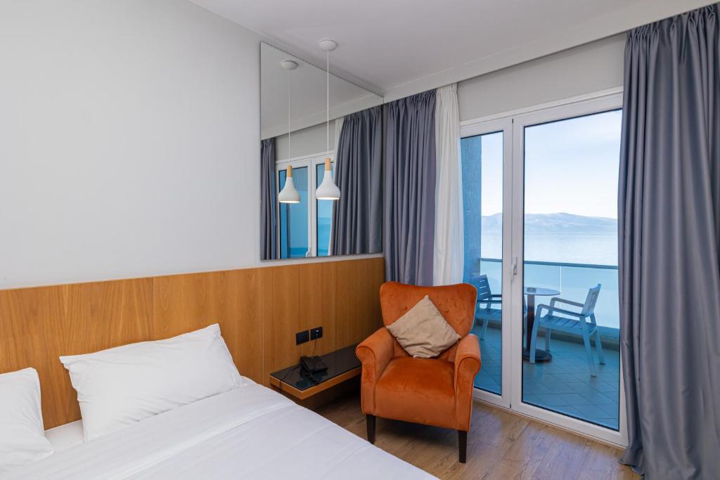 Postel nebo postele na pokoji v ubytování DUKA Hotel