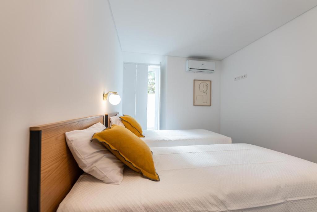 Postel nebo postele na pokoji v ubytování Brum Design Apartments I