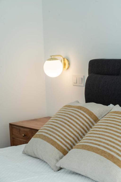 Postel nebo postele na pokoji v ubytování Brum Design Apartments I