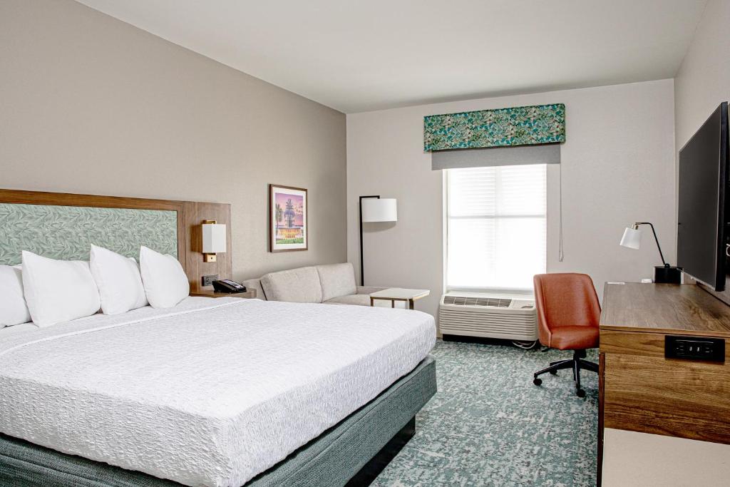 a hotel room with a bed and a window at Hampton Inn & Suites Charleston-West Ashley in Charleston