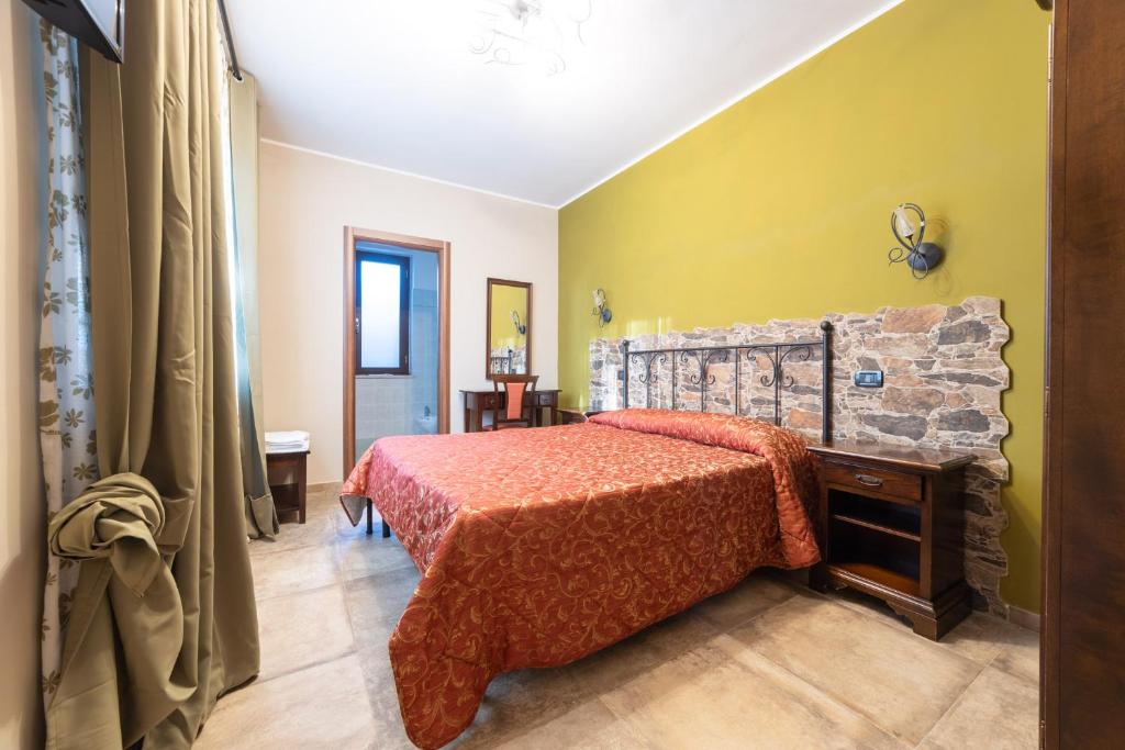 Łóżko lub łóżka w pokoju w obiekcie Agriturismo Parco delle Querce