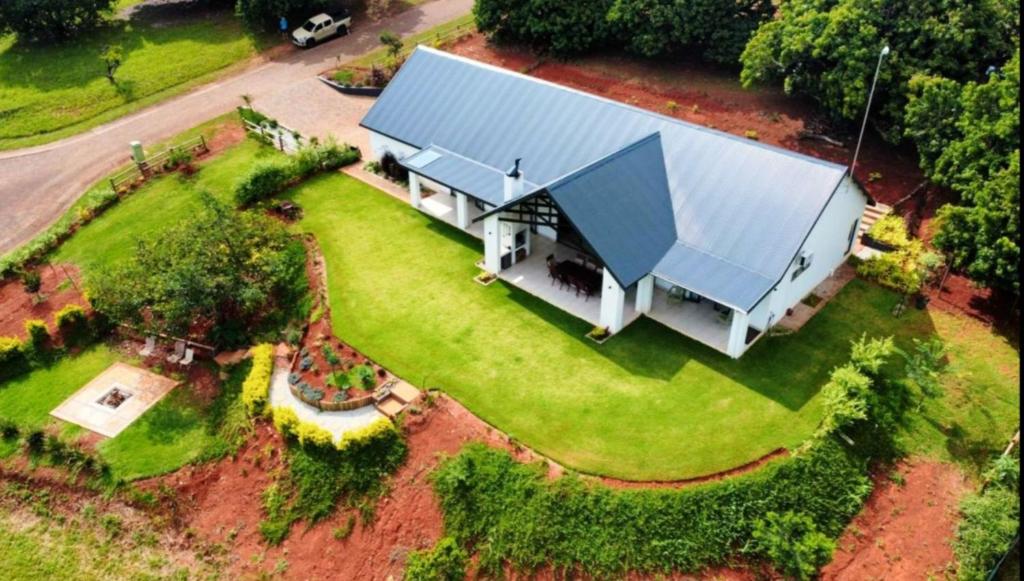 an aerial view of a large white building with a blue roof at Nature view in Tzaneen