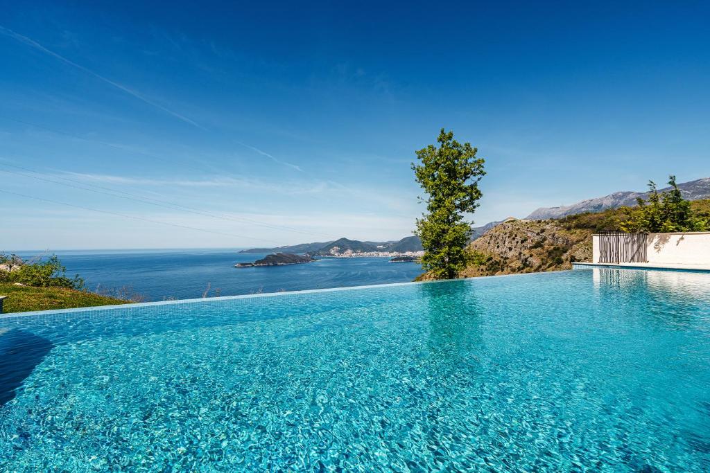 a swimming pool with a view of the ocean at Monte Living by In Property in Ðenaši