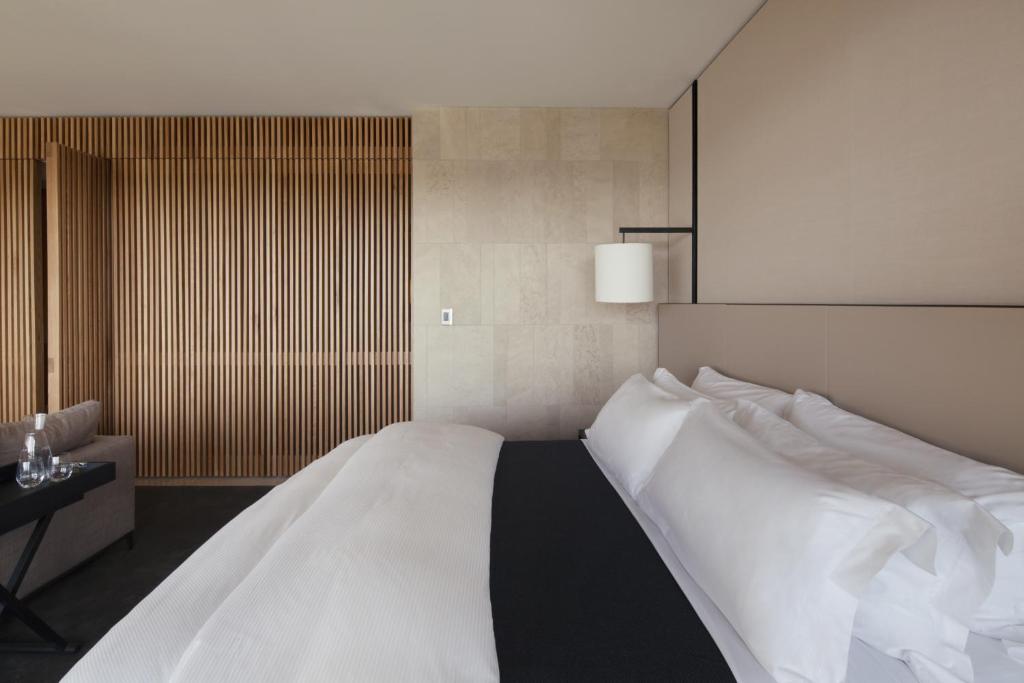 Postel nebo postele na pokoji v ubytování Hotel Realm