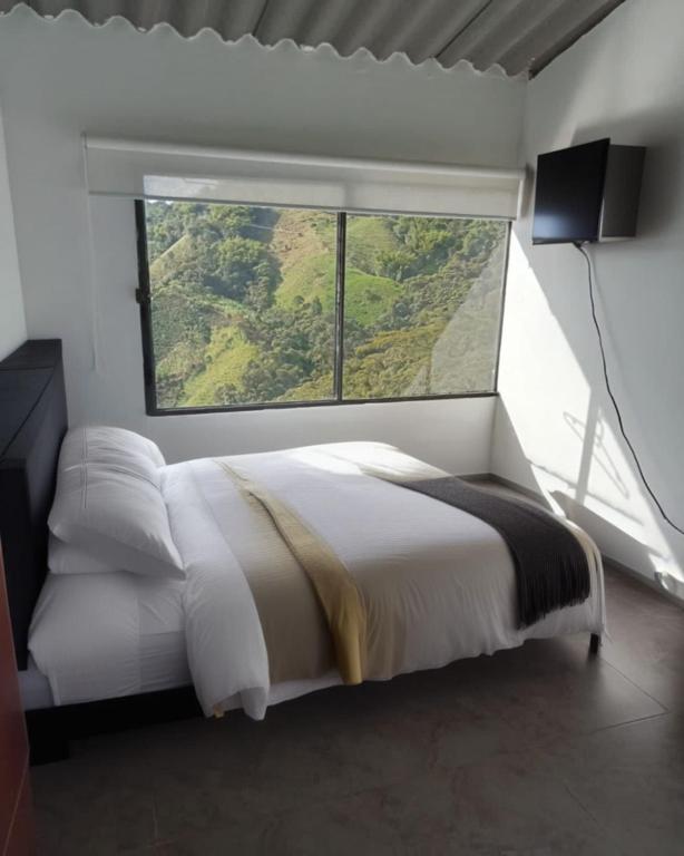 Postel nebo postele na pokoji v ubytování Ecohotel Portillo