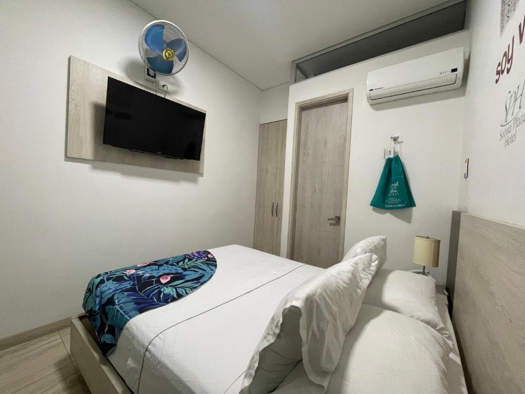 Postel nebo postele na pokoji v ubytování Hotel Sixtina Plaza Medellin