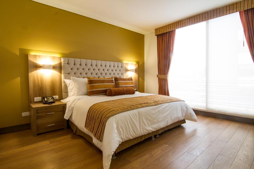 Postel nebo postele na pokoji v ubytování De Película Hotel