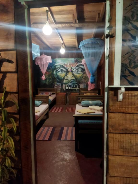 Postel nebo postele na pokoji v ubytování Hostal Tree House
