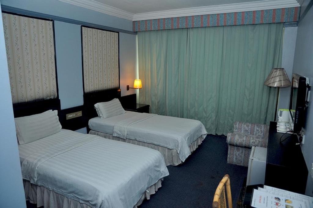 Postel nebo postele na pokoji v ubytování Hotel Deleeton