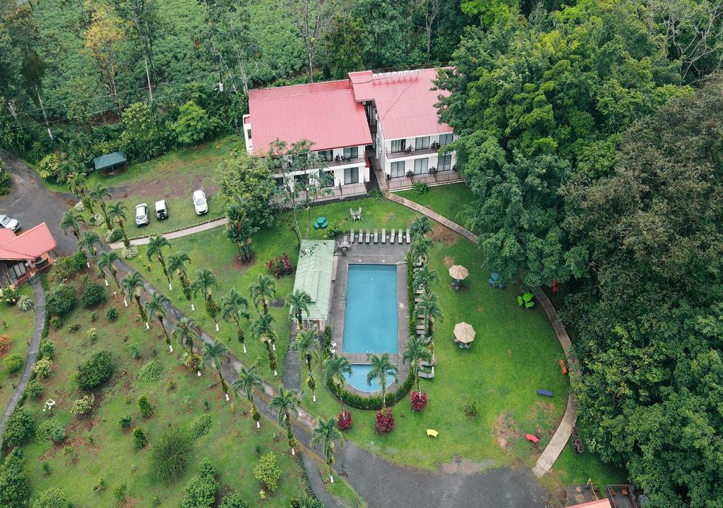 an aerial view of a house with a yard at Hotel Eco Arenal in Fortuna