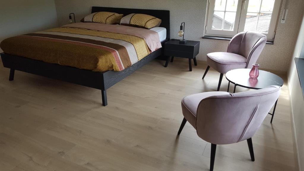 Postel nebo postele na pokoji v ubytování B&B Krieken de Jour