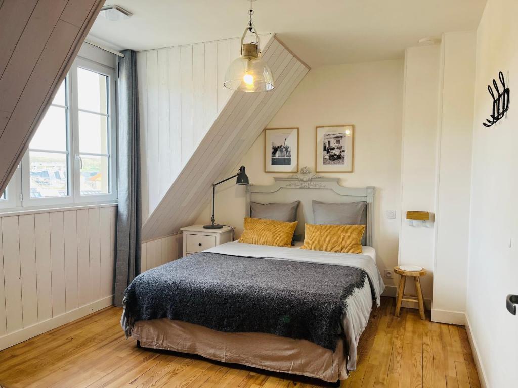 Кровать или кровати в номере Appartement cosy bord de mer
