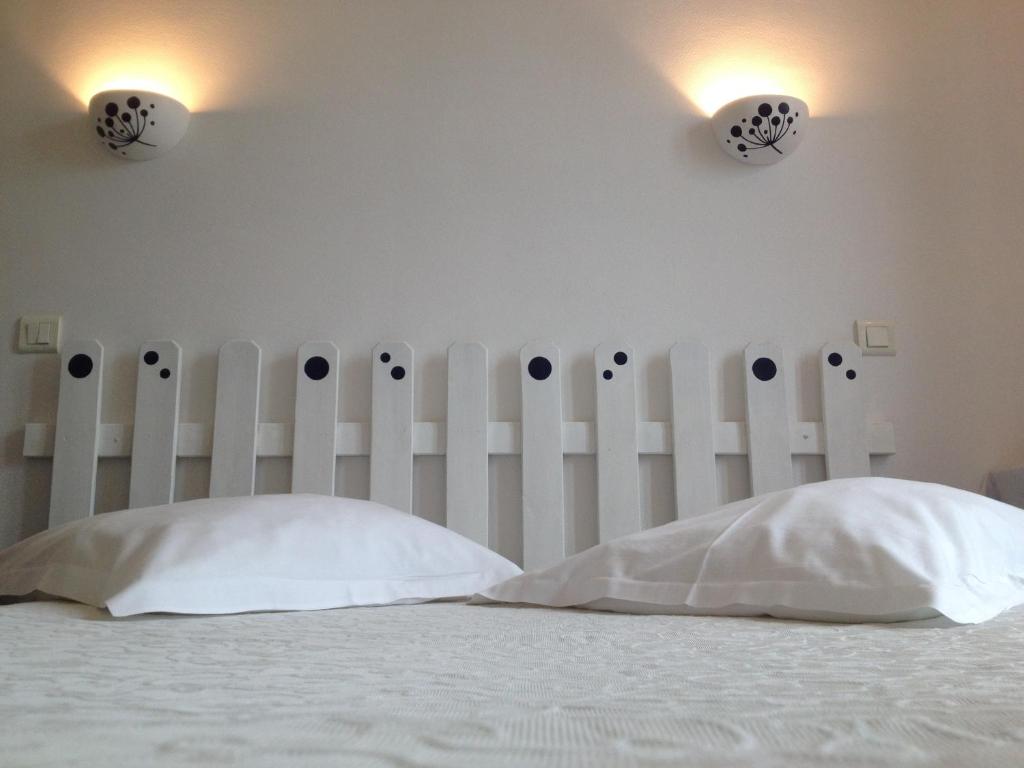 Postel nebo postele na pokoji v ubytování Au Nouvel Hôtel