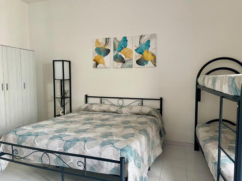 מיטה או מיטות בחדר ב-Ortensia Apartment