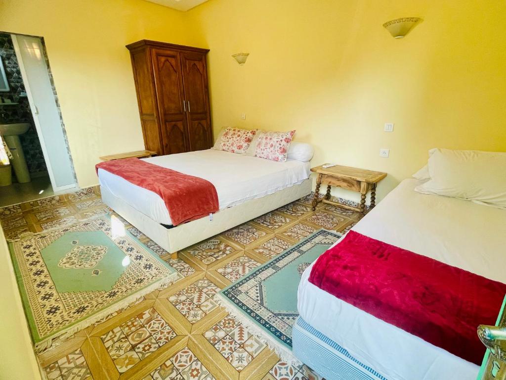 Postel nebo postele na pokoji v ubytování Villa Baddi Marrakech