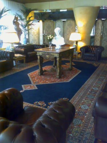 a living room with a table and a couch at Hotel Due Mori in Cittadella