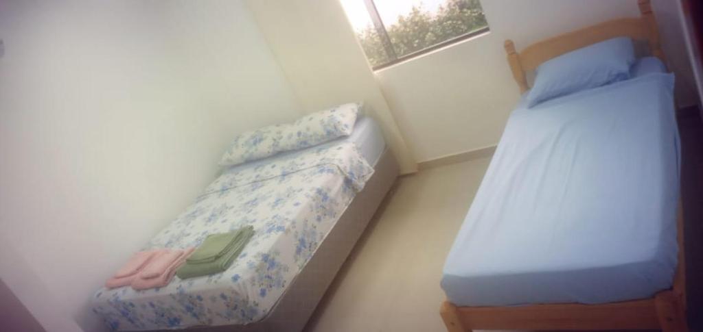 Postel nebo postele na pokoji v ubytování La Piña Dorada