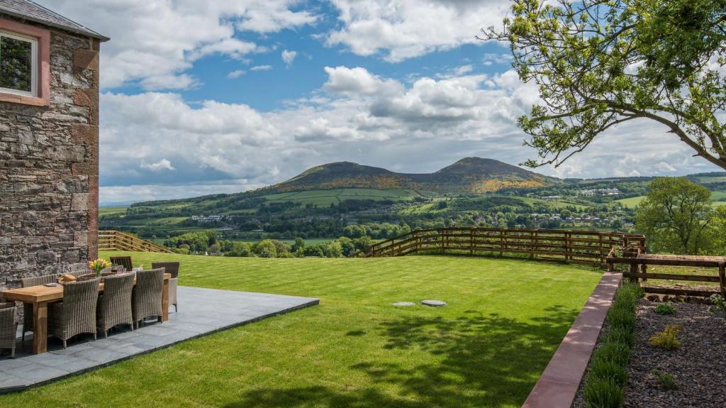 a garden with a view of mountains at Granary in Melrose