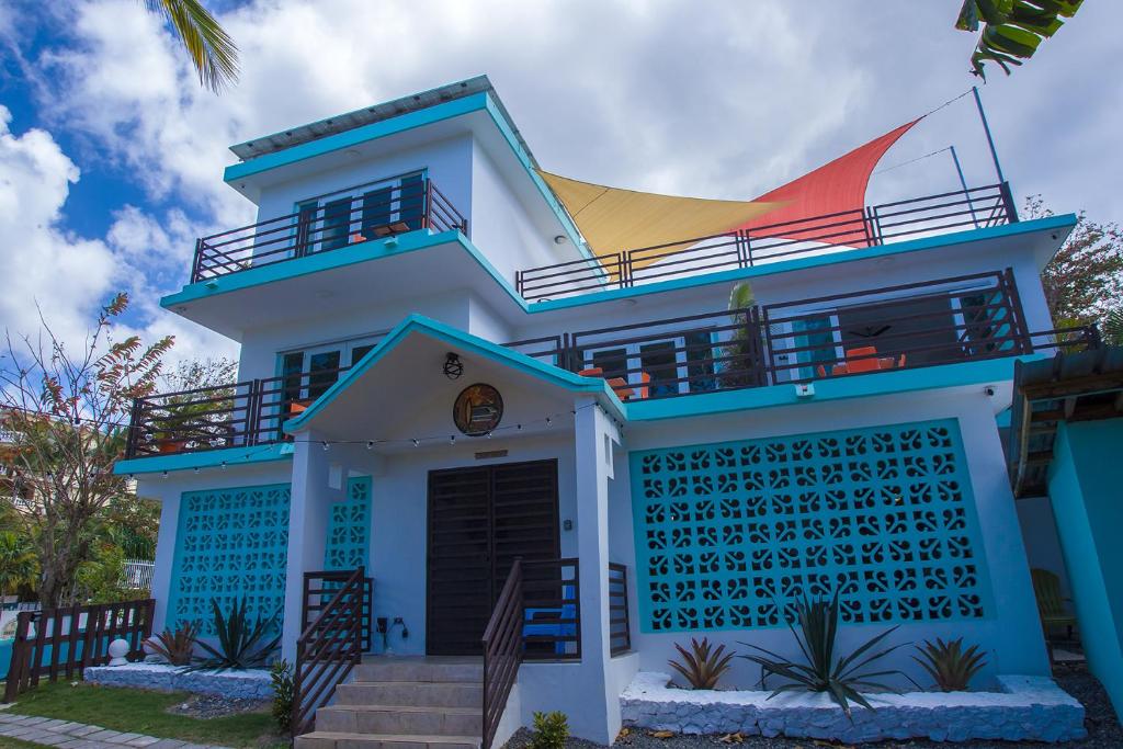 a blue and white house with a balcony at The Beach Pad in Rincon