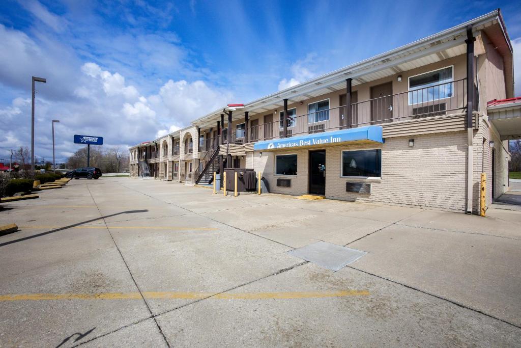 an empty parking lot in front of a building at Americas Best Value Inn-Celina in Celina