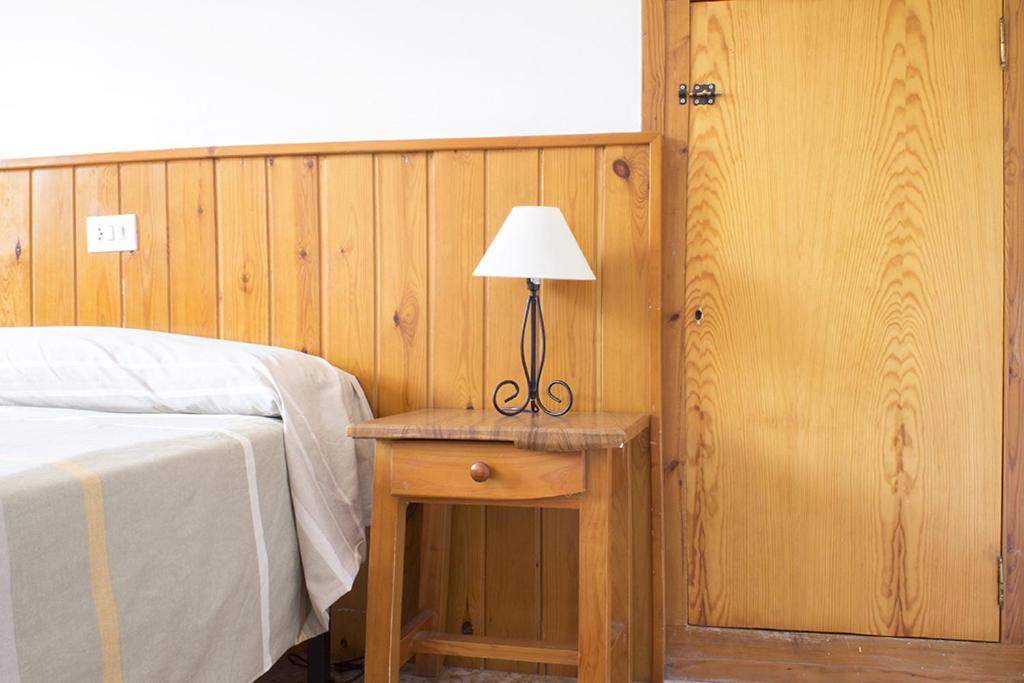 A bed or beds in a room at Apartamentos Grist