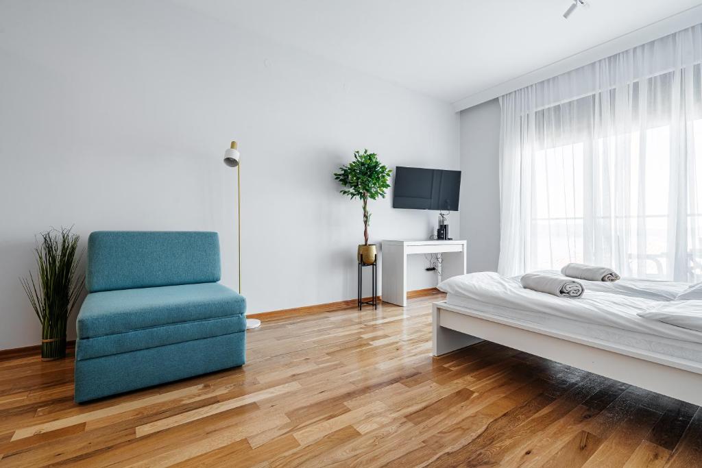 Postel nebo postele na pokoji v ubytování Przno Apartments by In Property
