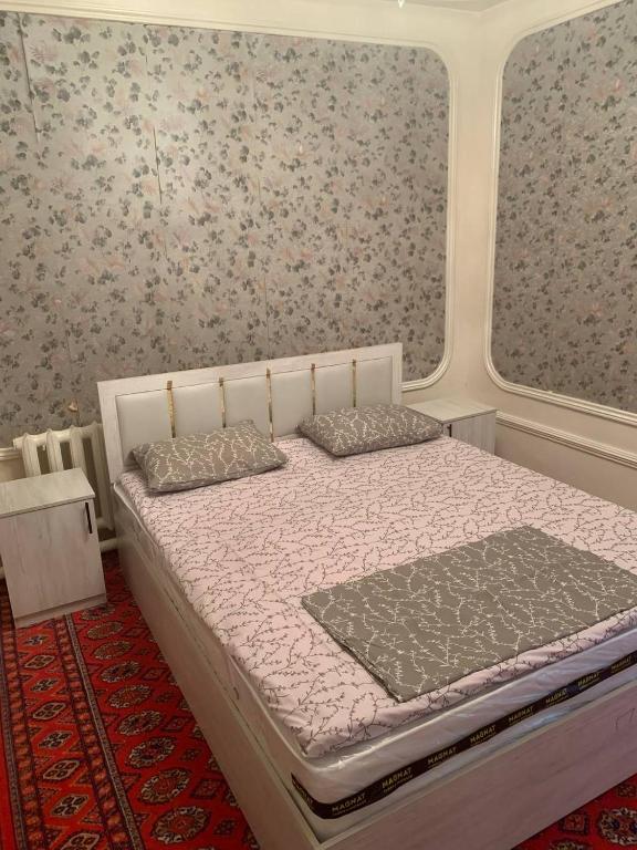 Säng eller sängar i ett rum på Массив саттепо
