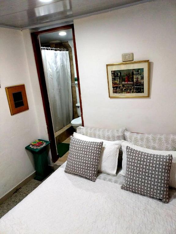 Postel nebo postele na pokoji v ubytování Hotel Posada Turística la Ceiba