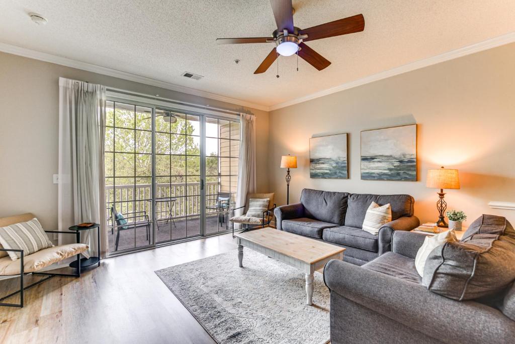 a living room with a couch and a ceiling fan at North Myrtle Beach Condo Rental with Pool Access! in North Myrtle Beach