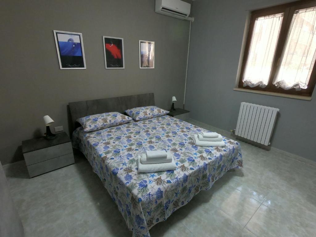 Postel nebo postele na pokoji v ubytování ScarpiHouse