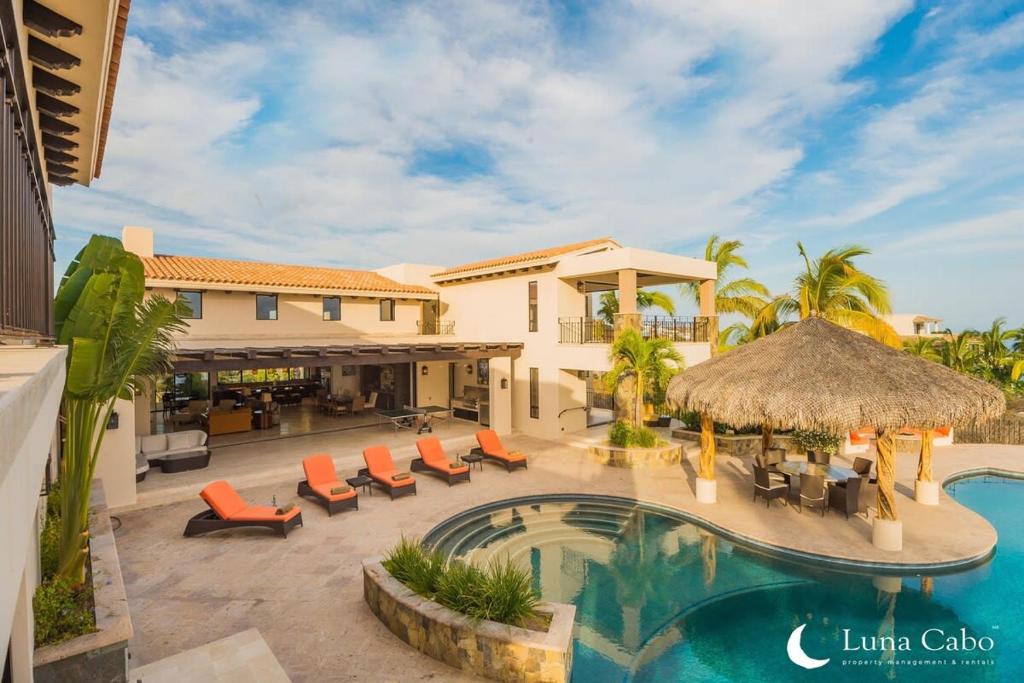 an image of a villa with a swimming pool at Firepit Sunsets, Hot Tub Soaks, BBQ, Ocean Views in San José del Cabo