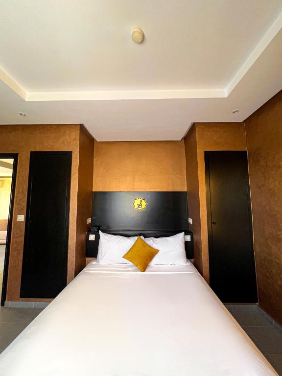 Postel nebo postele na pokoji v ubytování La Suite Hotel Agadir Adults Only