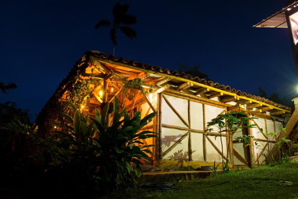 a greenhouse at night with lights on it at CENTRO HOLISTICO ALLPA SAMAY in Puentetierra