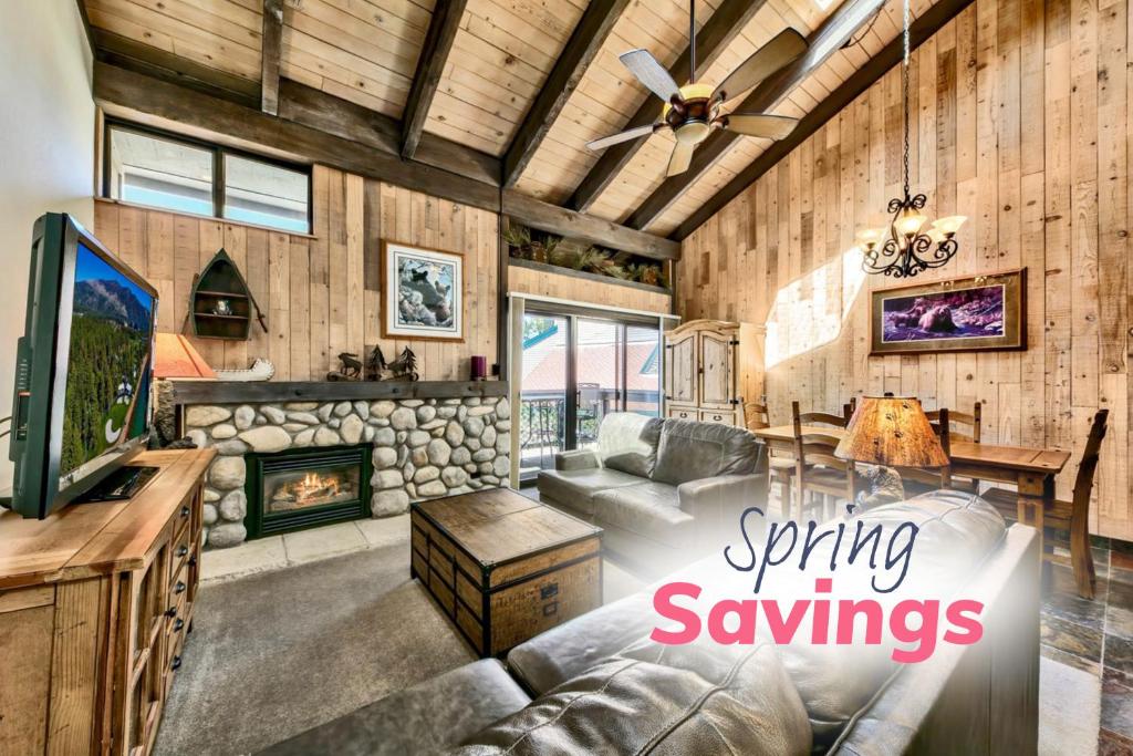 a living room with a couch and a fireplace at Lakeland Village 462 - Walk to Lake Rustic 2.5BR in South Lake Tahoe