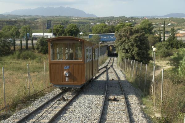 a trolley car on the tracks near a tunnel at Apartamento Gerimar - Gelida/Bcn in Gélida