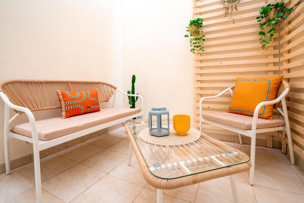 a room with two chairs and a table at Dante95 in Polignano a Mare