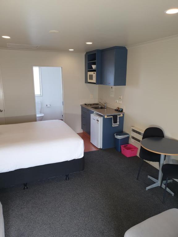 Kuchyň nebo kuchyňský kout v ubytování Northcote Motor Lodge