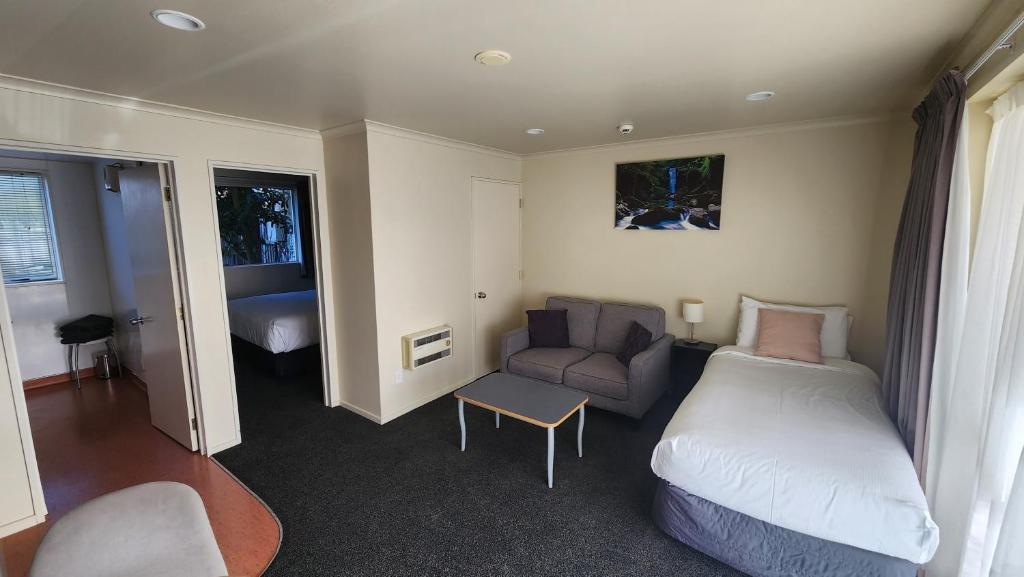 Postel nebo postele na pokoji v ubytování Northcote Motor Lodge