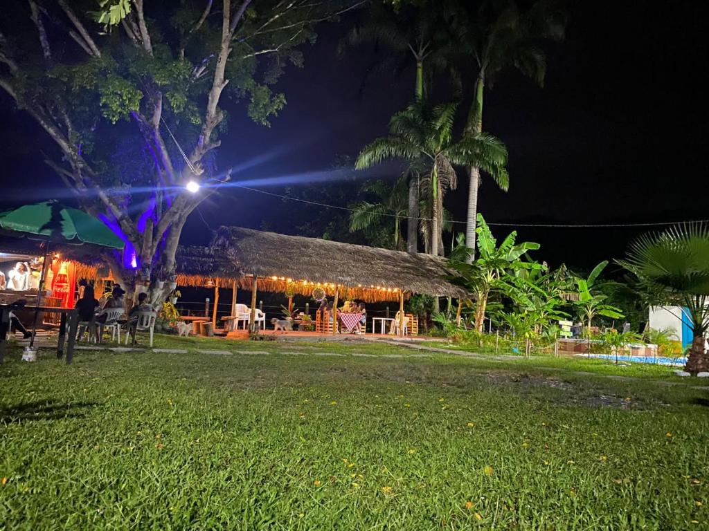 a restaurant at night with lights on it at Casa campestre Villa sofia in Utica