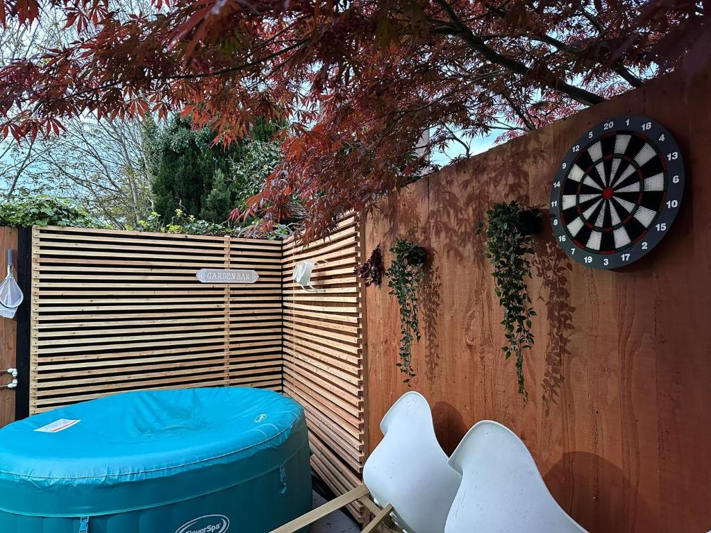 a dart board on a fence next to a target at 1 Bedroom apartment With Hot Tub in cardiff in Cardiff
