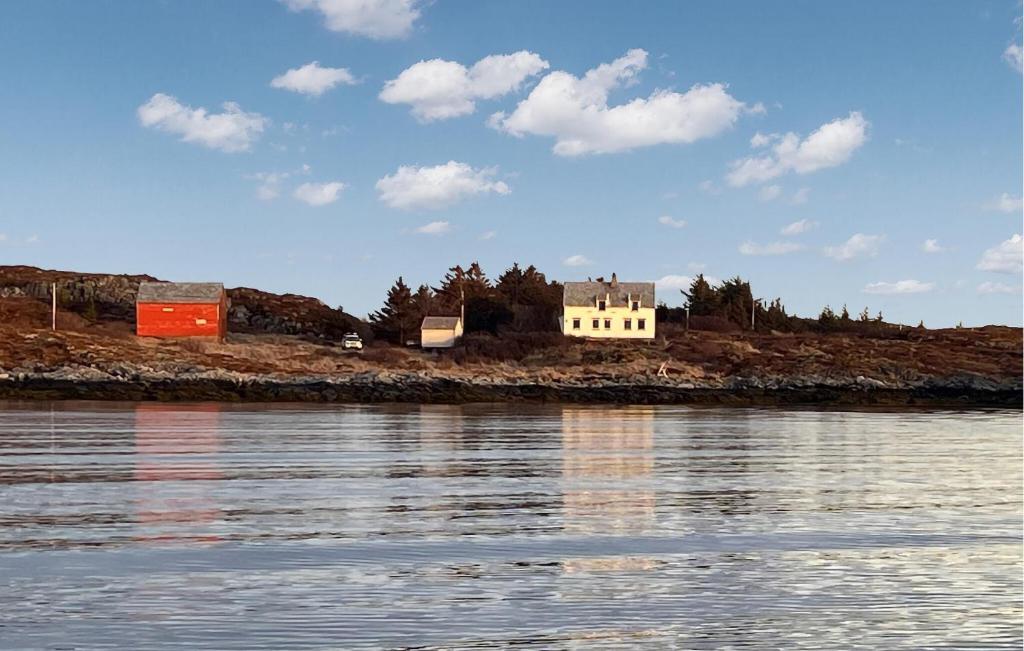 a house on an island in a body of water at Nice Home In Smøla With House Sea View in Smøla