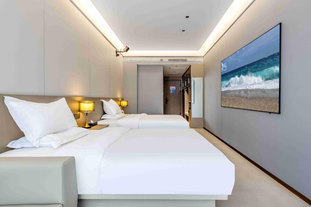 Letto o letti in una camera di Kunming Yuxi Hotel