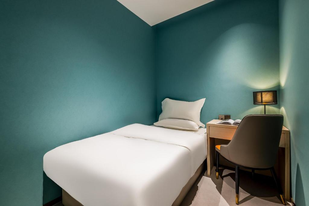 Letto o letti in una camera di Kunming Yuxi Hotel